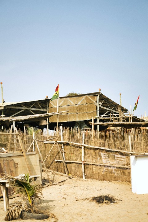 a wooden structure with a flag on top of it