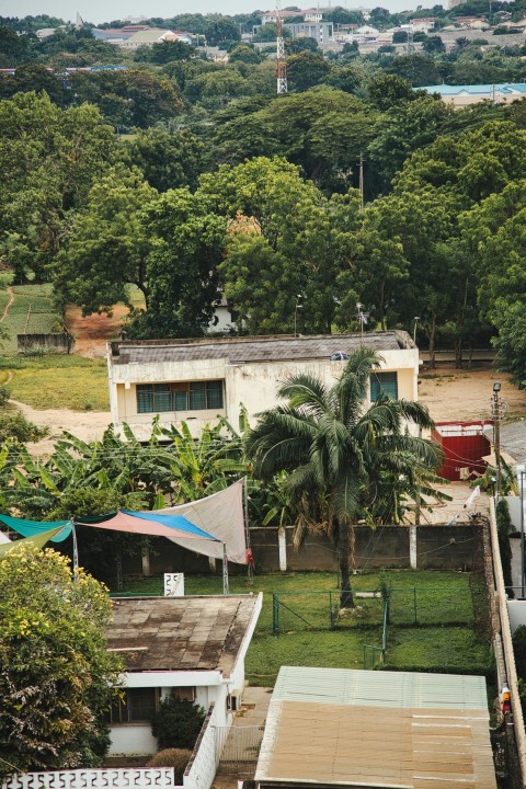 a view of some houses and trees from a hill J2V