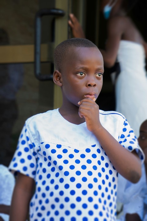 boy in white and blue polka dot crew neck t shirt