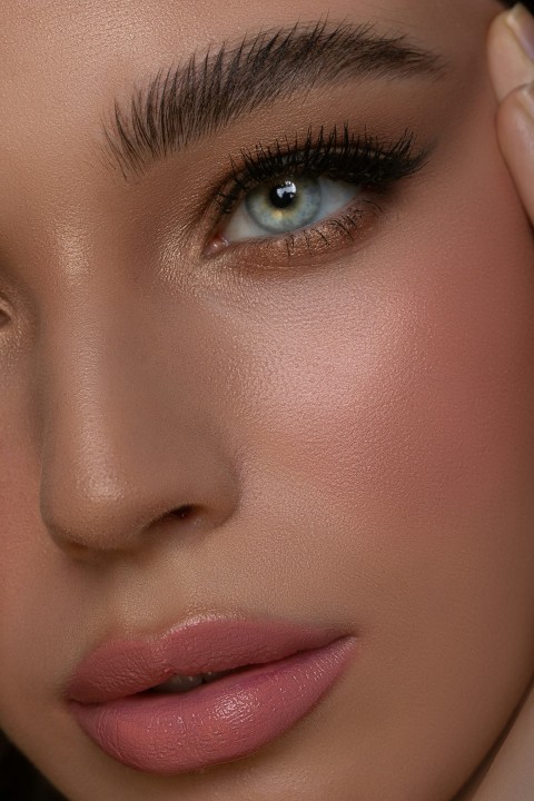 a close up of a woman with blue eyes