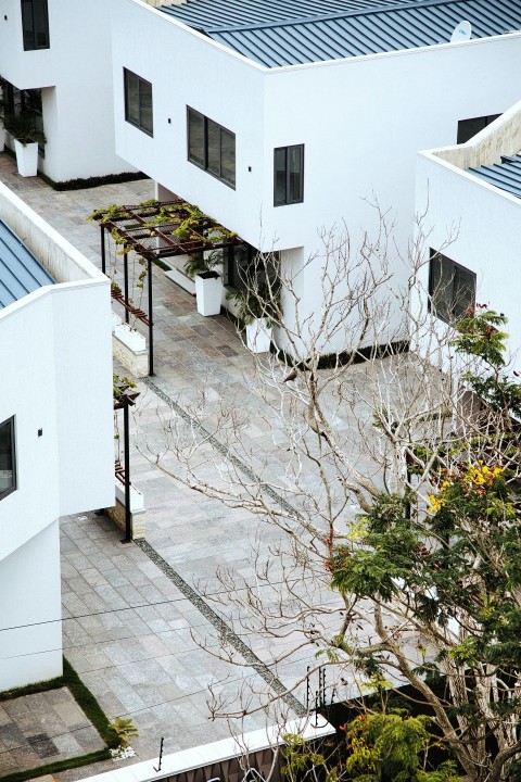 an aerial view of a building with a courtyard