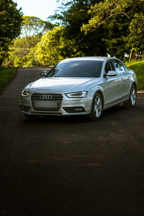 a silver car parked on the side of a road