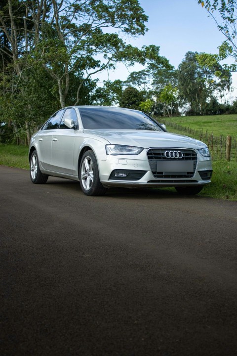 a silver car parked on the side of a road