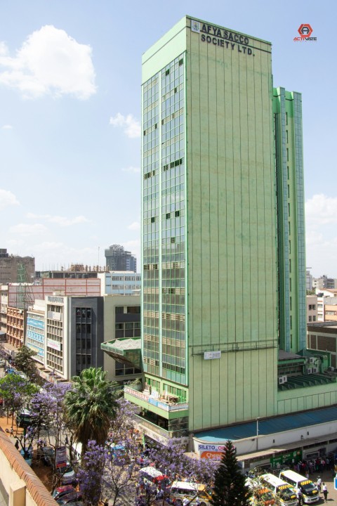 a tall green building