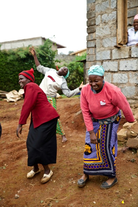 three women dancing outdoor during daytime