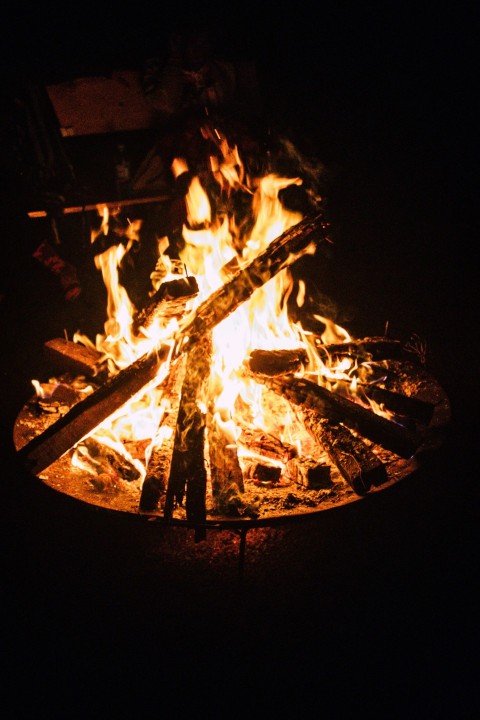 a fire pit is lit up in the dark