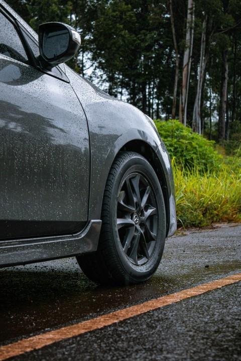 a close up of a car parked on the side of the road