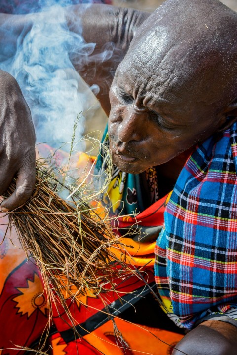 person making fire