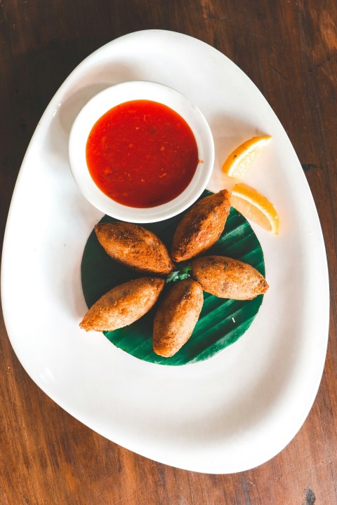 a plate of food on a wooden table