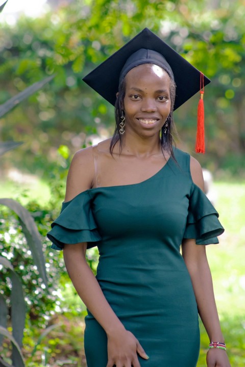 a woman in a graduation cap and gown