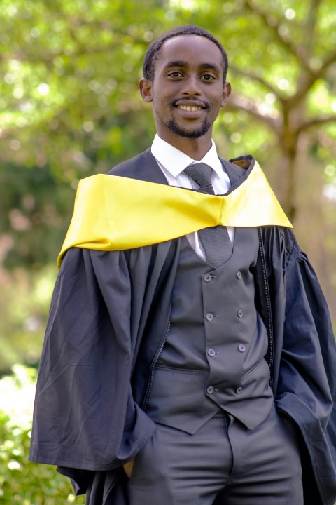 a man in a suit and tie is smiling