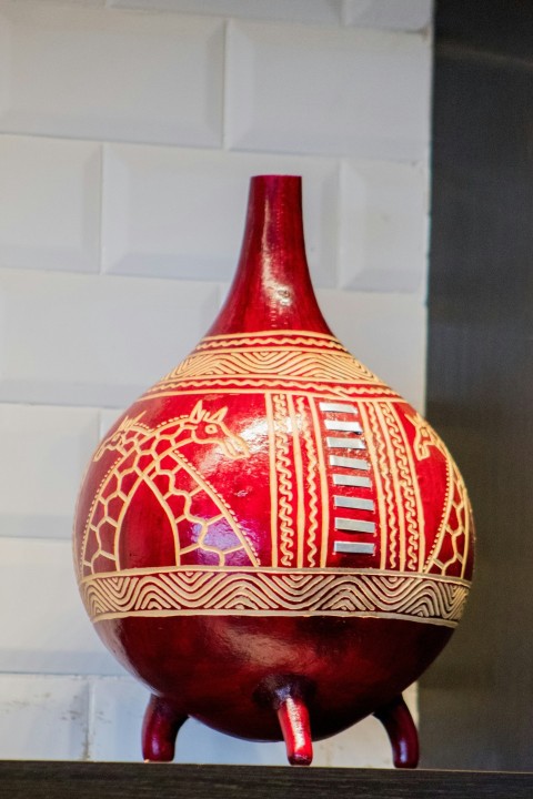 red and brown ceramic vase