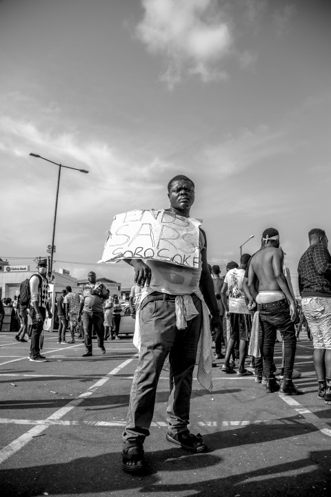 grayscale photo of people walking on street