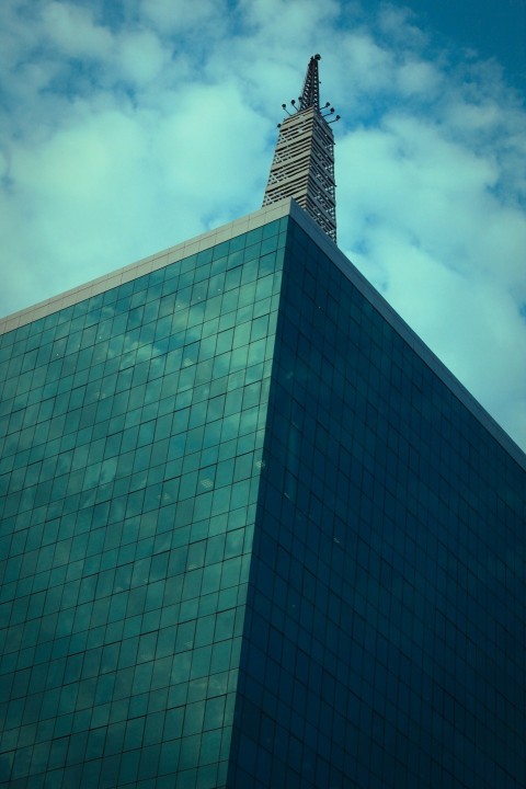 a tall building with a blue sky