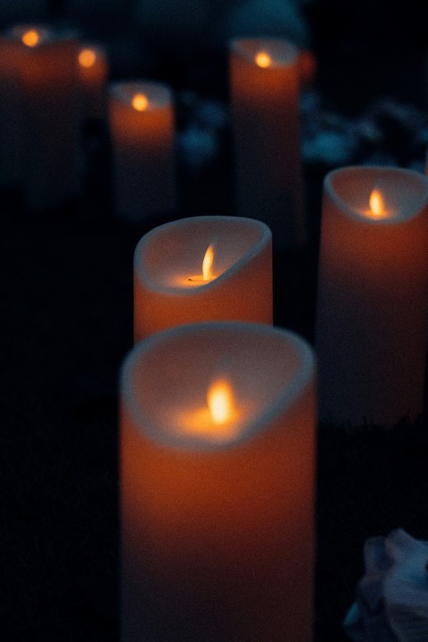 red candles on black textile ITyTzI