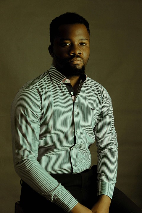 man in white and black pinstripe dress shirt