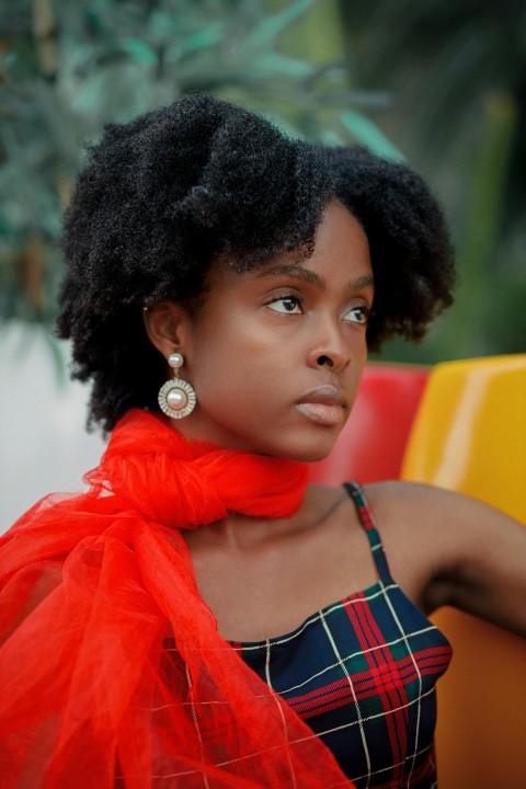 a woman with a red scarf around her neck