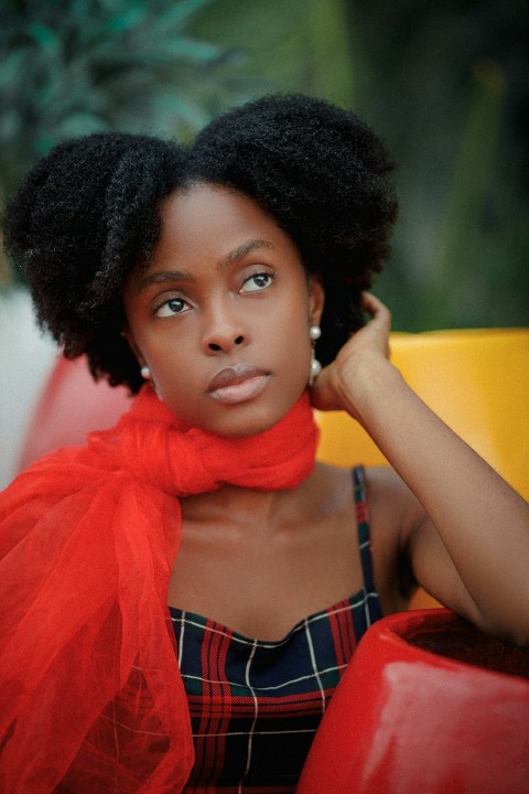 a woman with a red scarf around her neck