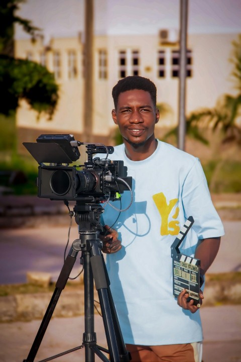 a man standing in front of a camera