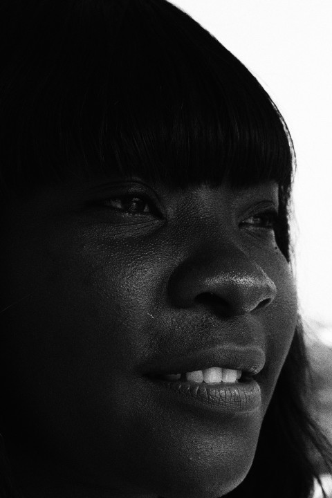 a black and white photo of a womans face