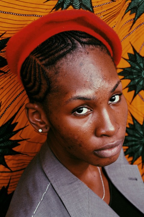 a woman with a red hat on top of her head