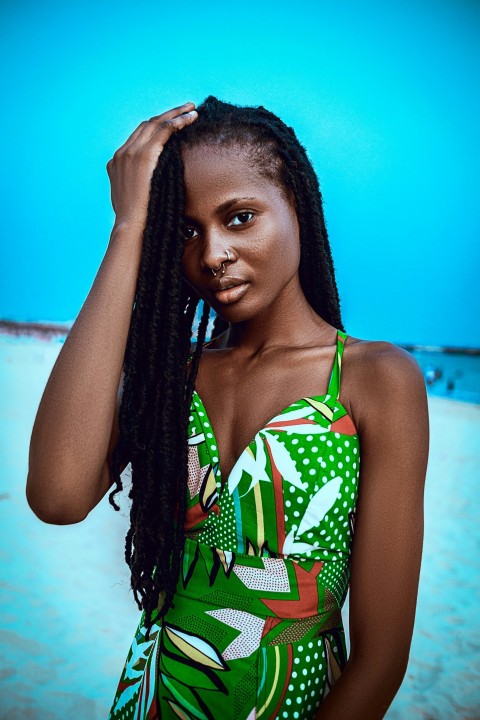 a woman in a green and white one piece swimsuit