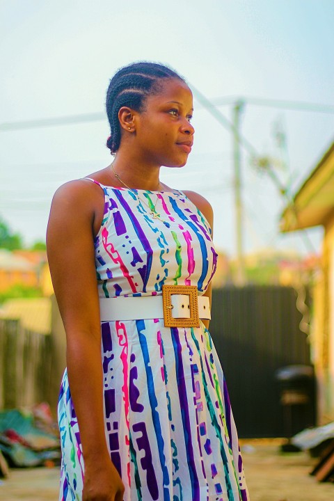 woman in white and red floral sleeveless dress