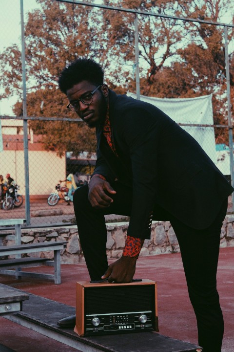 standing man holding radio