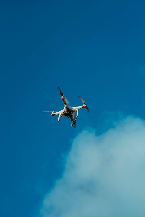 white and red airplane flying in the sky 6bYdL