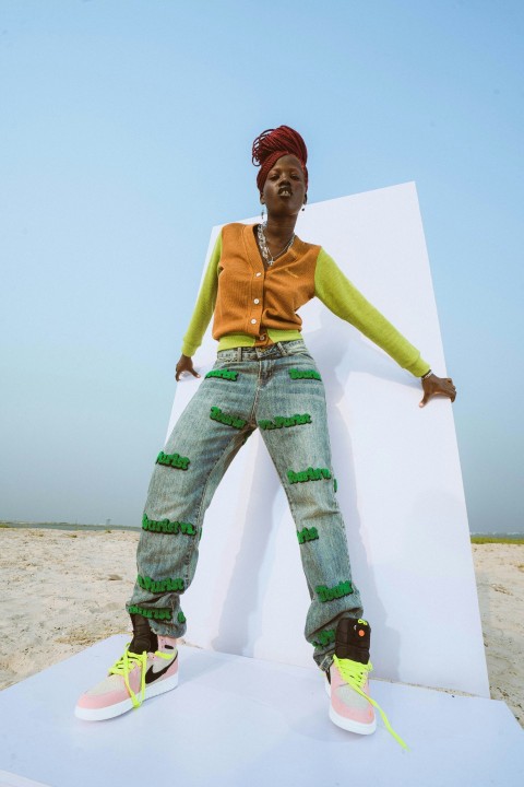 a woman standing on top of a white structure