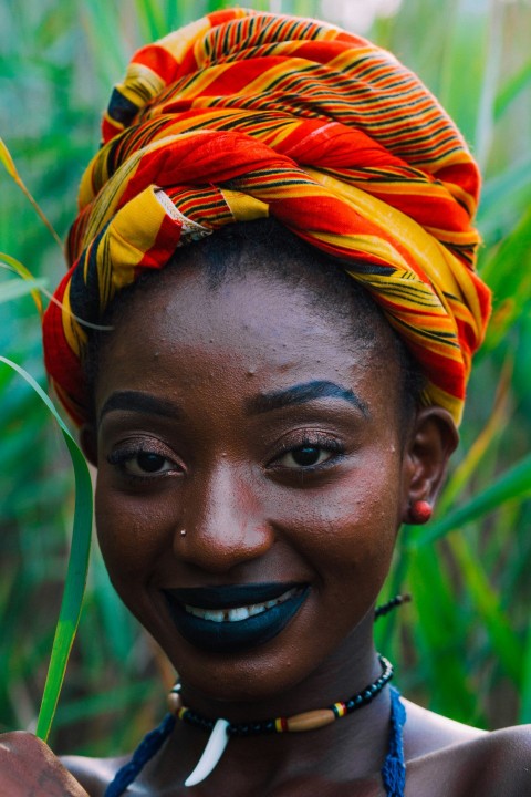 woman in orange and yellow feather headdress fPW