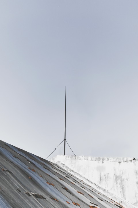 black metal roof under white sky during daytime HyU_