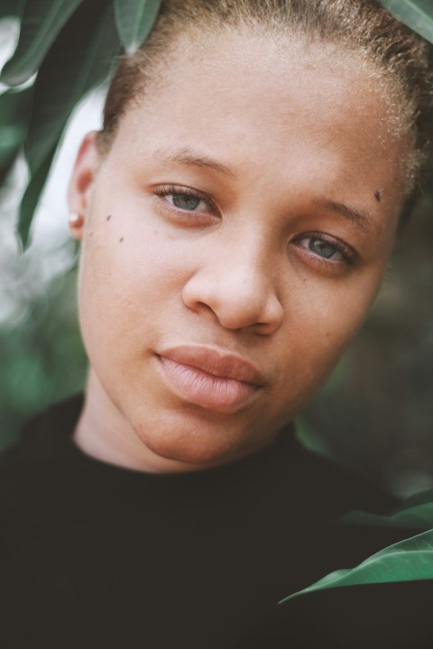 close lip woman in black top in close up photography