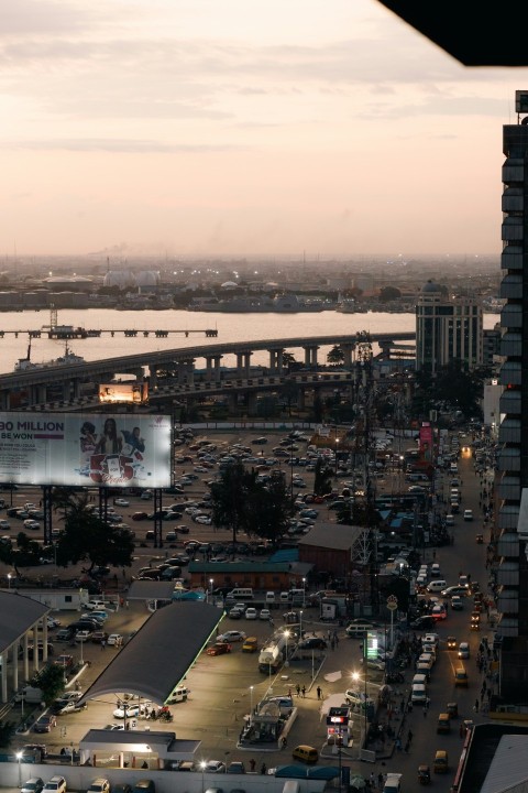 a view of a busy city street with a bridge in the background Lpk_o