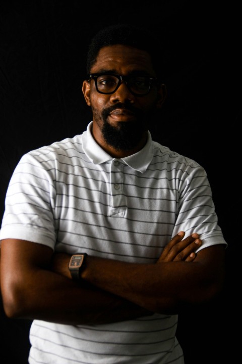 man in white and blue striped button up shirt wearing black framed eyeglasses