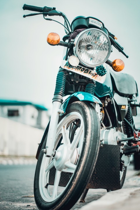 green and black motorcycle on road during daytime iLdhnj8JC