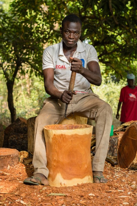 man in white crew neck t shirt holding brown and black power tool