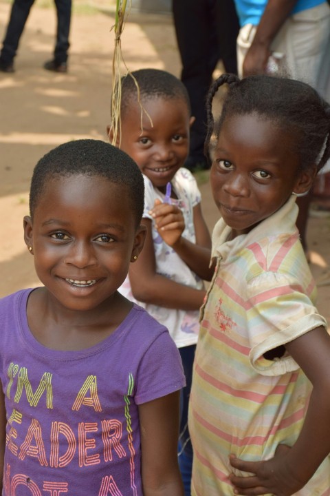 a group of young children standing next to each other