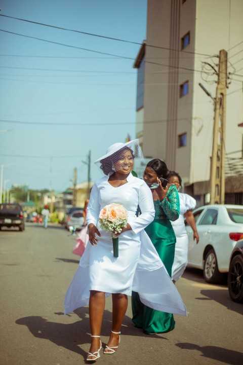 a woman in a white dress and a woman in a green dress