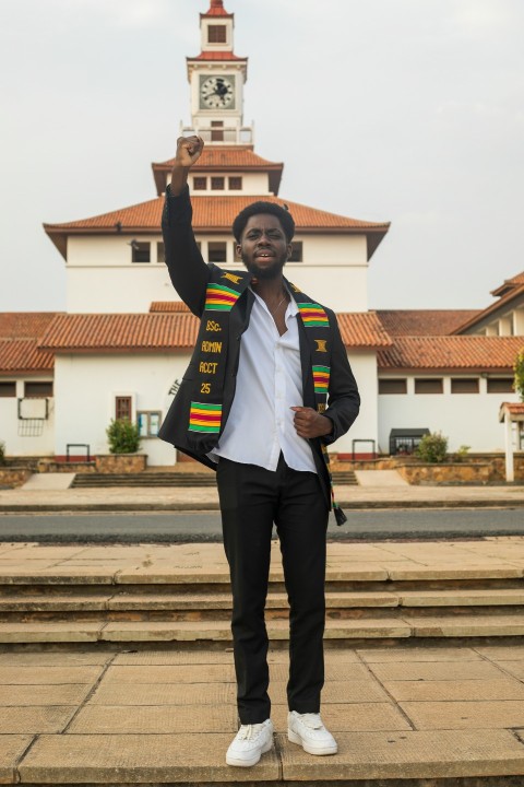 man in black suit standing on brown concrete stairs during daytime