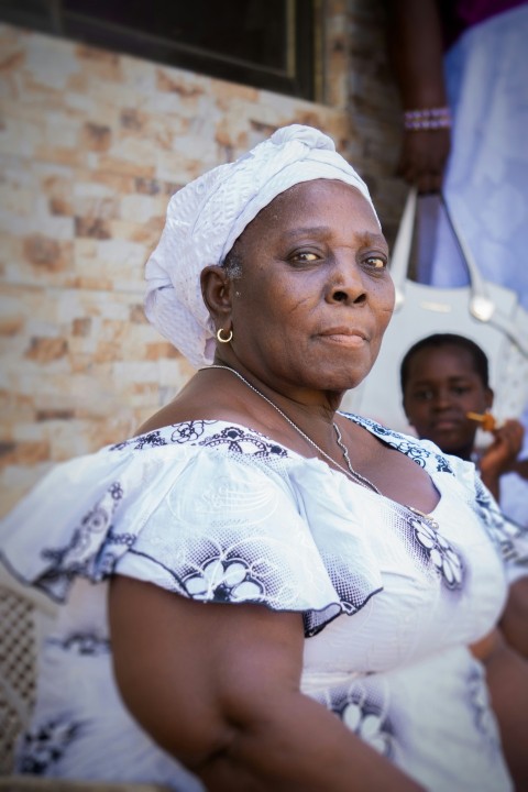 woman in white floral dress wearing white head band