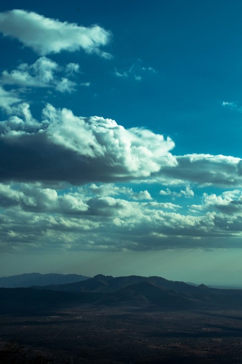 a view of a mountain range with clouds in the sky eroILgqA