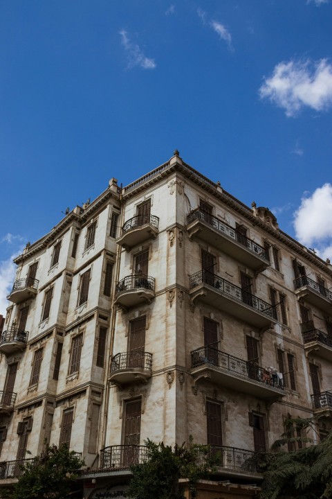 a tall building with balconies and balconies on the top of it