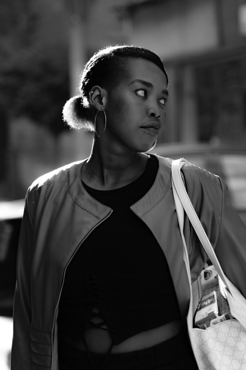 a black and white photo of a woman with her eyes closed