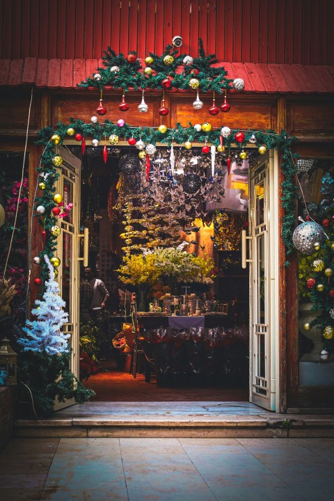 a store front with christmas decorations on the outside of it