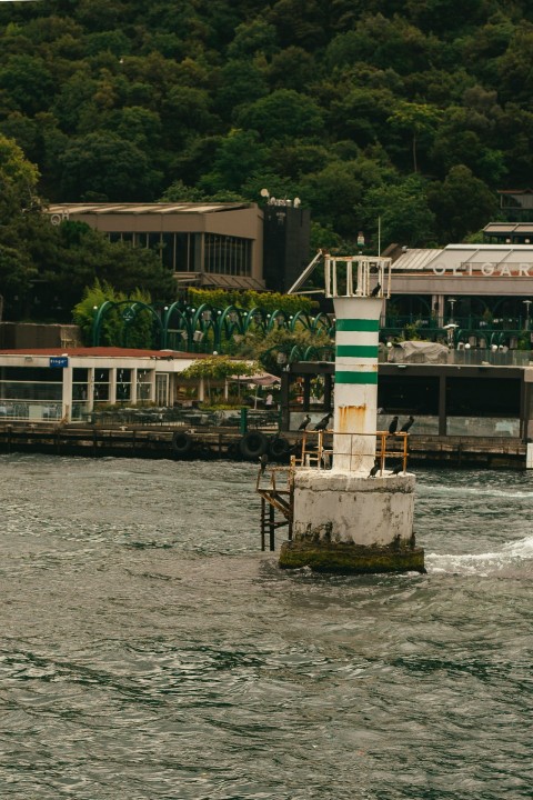 a large body of water with a clock tower in the middle of it B93Sso