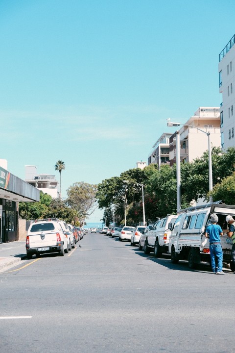 a street with cars and people