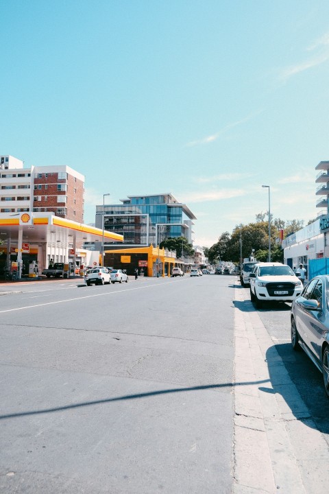 a street with cars and buildings on the side