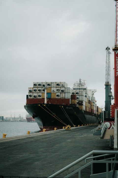 a large cargo ship docked at a dock