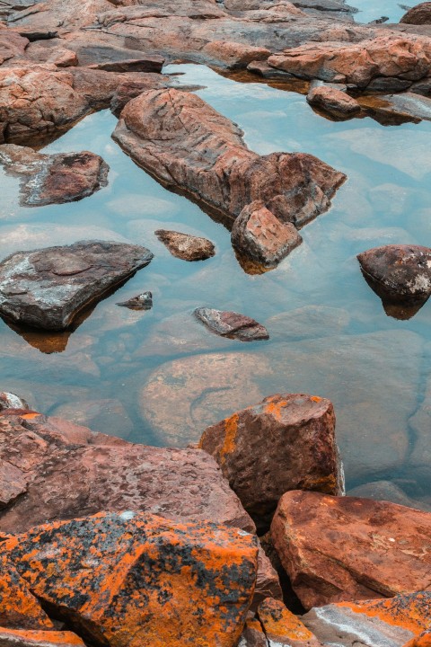 some rocks and water in a body of water